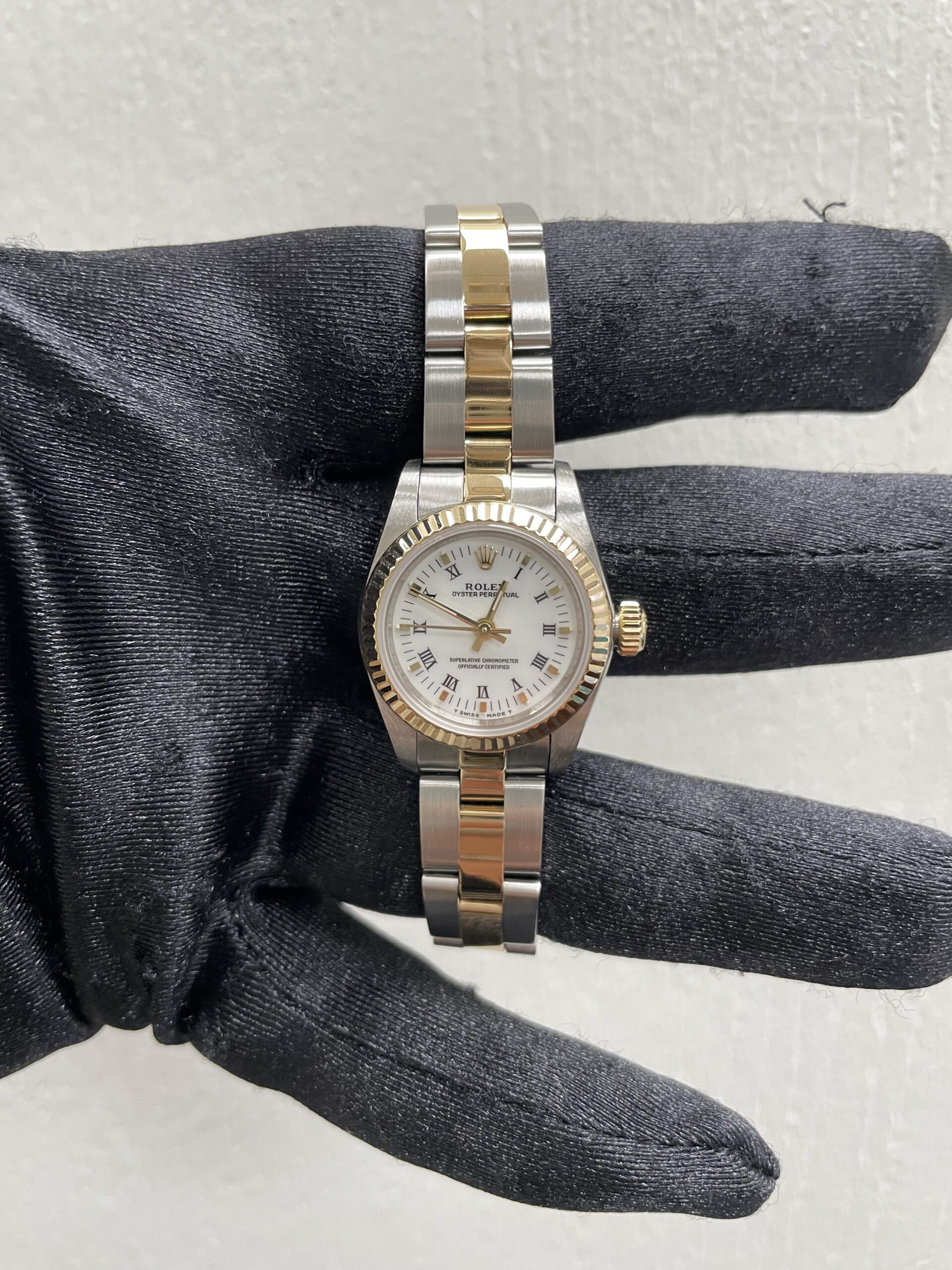 19138845_sg2qgmtgyaqirve66a56bfh0zy0n.jpg Rolex Oyster Perpetual White Roman Dial on Oyster Ref 67193 with Papers 1997 - Image 1