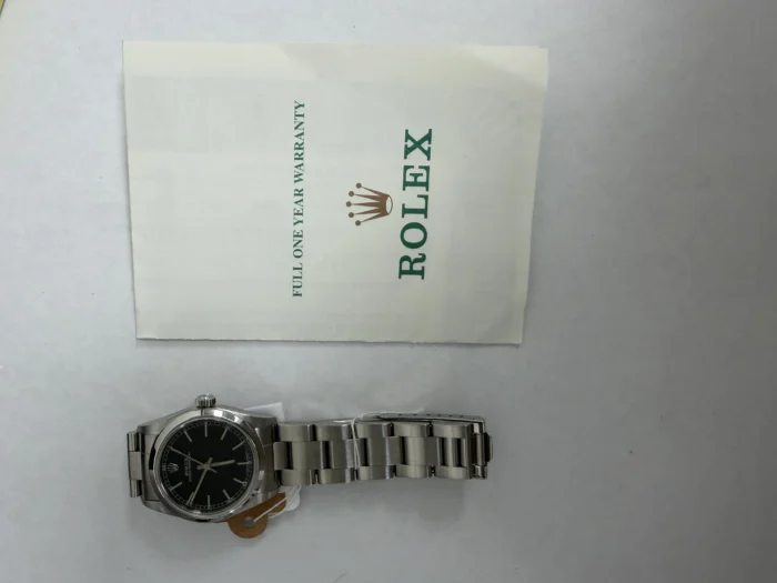 Rolex Oyster Perpetual Black Dial on Oyster Ref. 67480 with Papers 1999 - Image 5