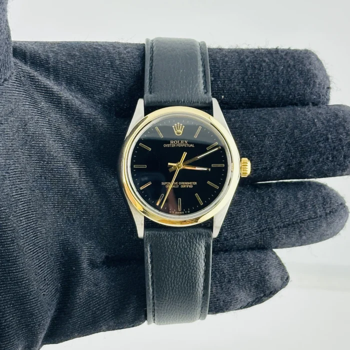 Rolex Oyster Perpetual Black / Gold Stick Sigma Dial on Generic Leather Band Ref. 1002 - Image 1